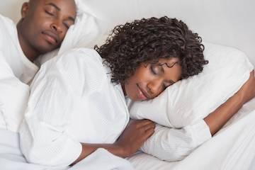man and woman sleeping peacefully | sleep apnea treatment arvada, co
