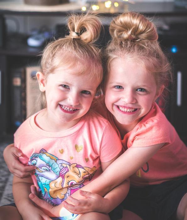 two young girls smiling