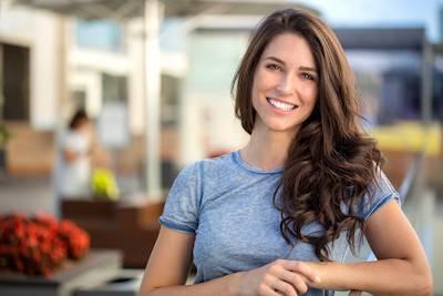 cosmetic dentist arvada CO | woman smiling outside