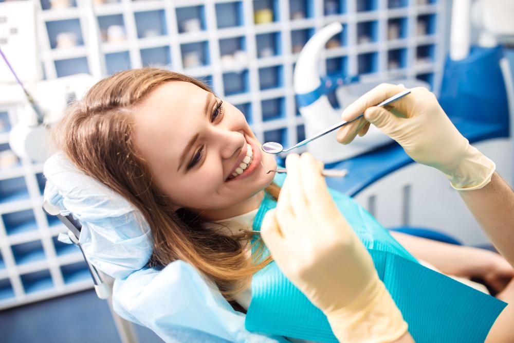 root canal treatment arvada | woman at dentist