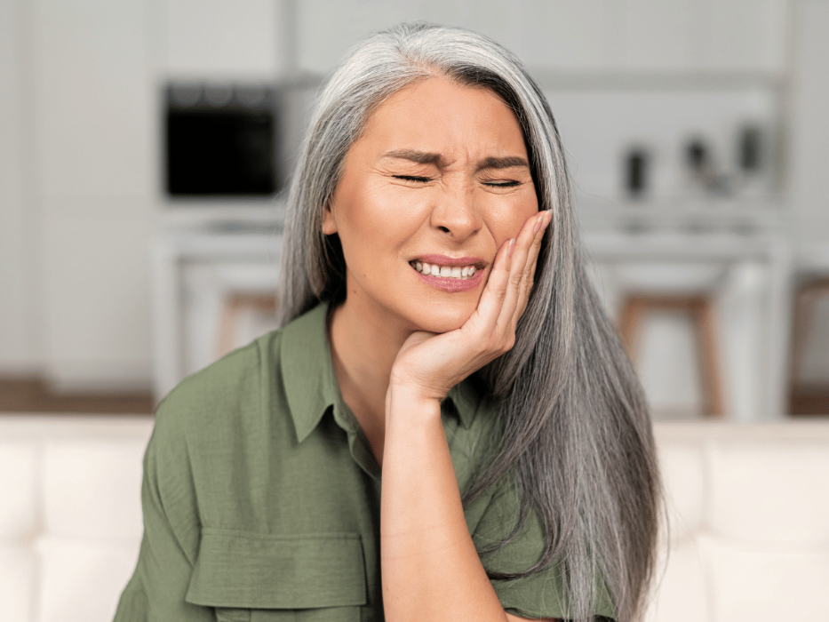 teeth grinding treatment arvada | woman with jaw pain