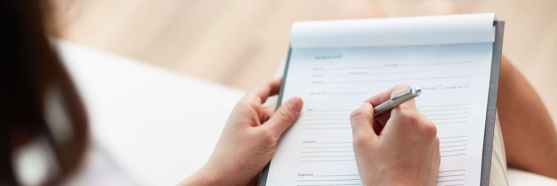 dentist Arvada | woman filling out her dental insurance information