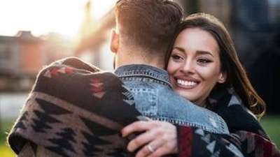 A smiling couple hugging | Dentist Arvada, CO