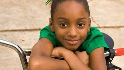 children's dentist arvada | child sitting on her bike