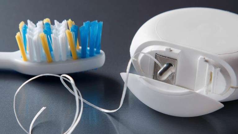 family dentist arvada | A toothbrush and floss