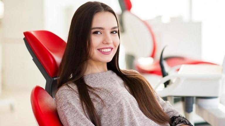 cosmetic dentistry arvada | woman at dentist