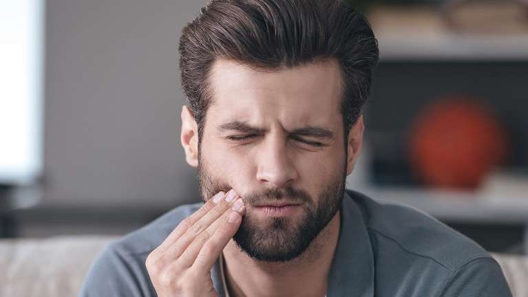 man with jaw pain | tmj treatment arvada co