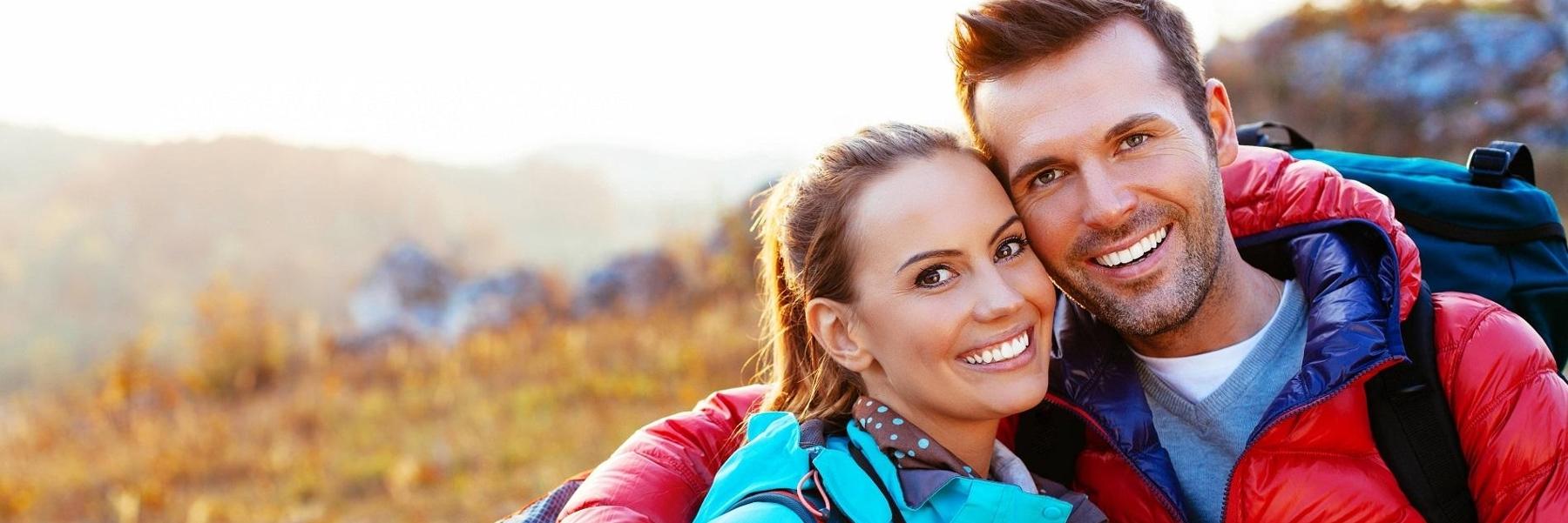 arvada dentist | couple smiling on hike
