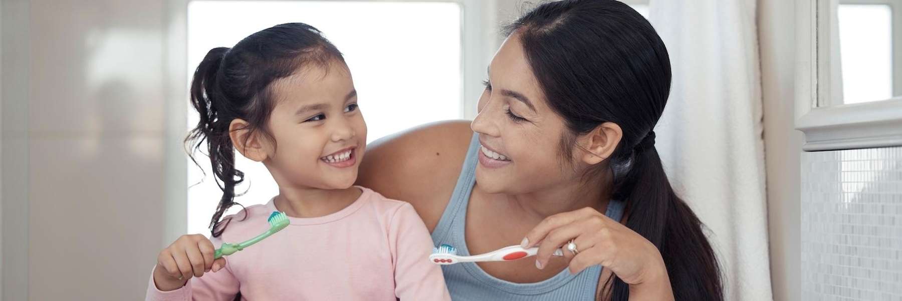 dental office arvada | family brushing teeth