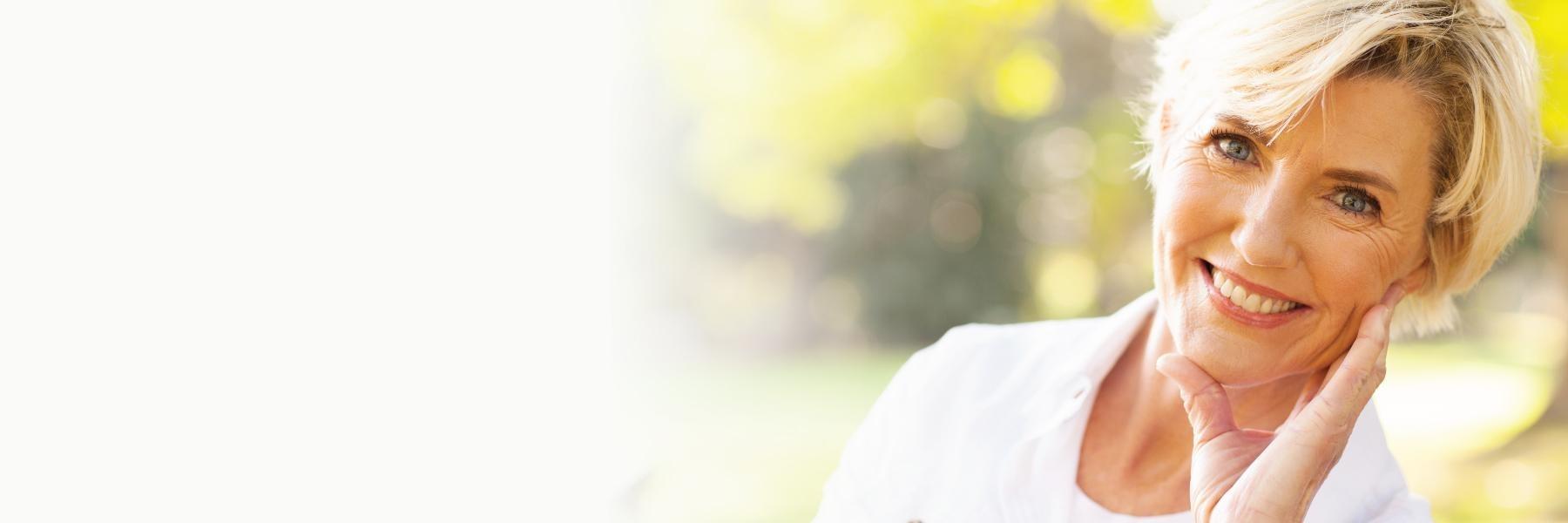 woman smiling with dentures in arvada CO